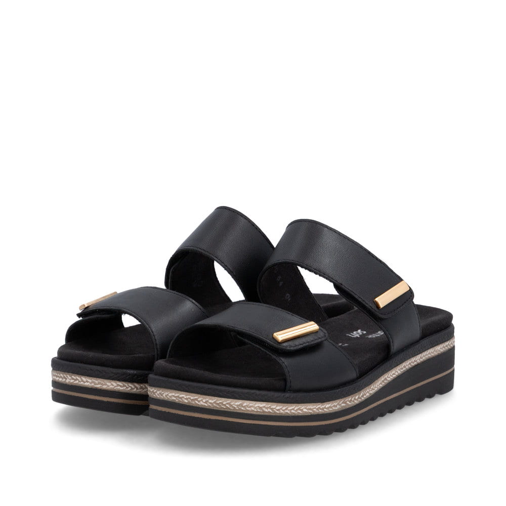 Mules remonte noires pour femme D0Q64-00 avec fermeture velcro. Chaussures inclinées sur le côté.