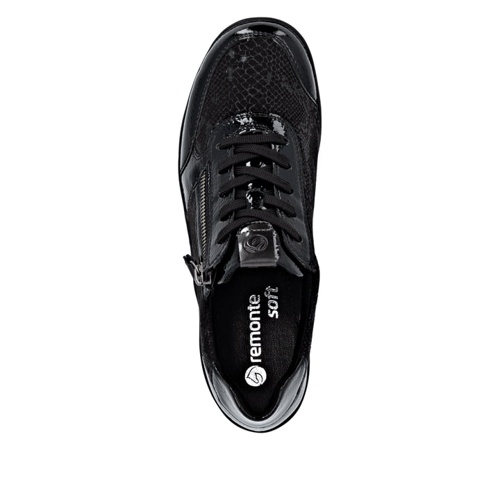 Baskets basses remonte noires pour femme R7637-04 avec fermeture éclair. Semelle extérieure de la chaussure.