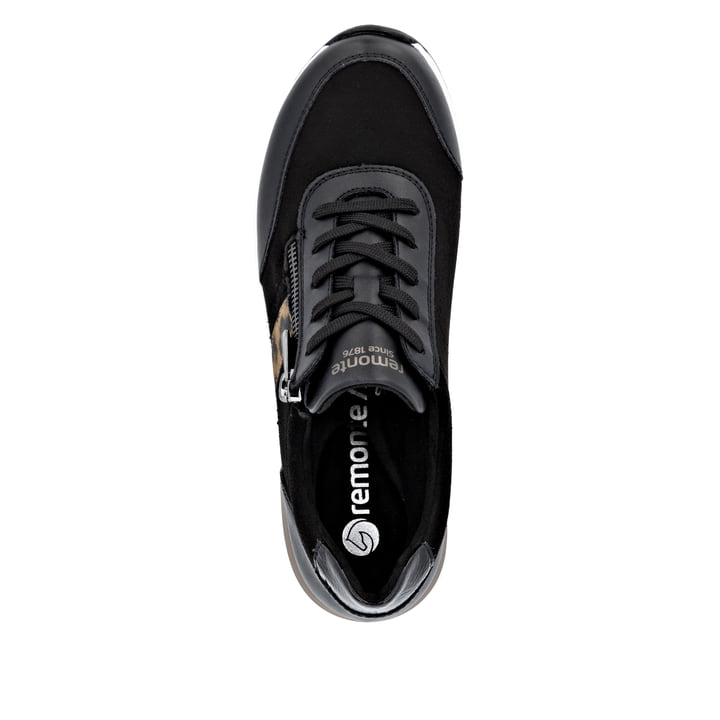Baskets basses remonte noires pour femme D0T09-04 avec imprimé léopard. Semelle extérieure de la chaussure.