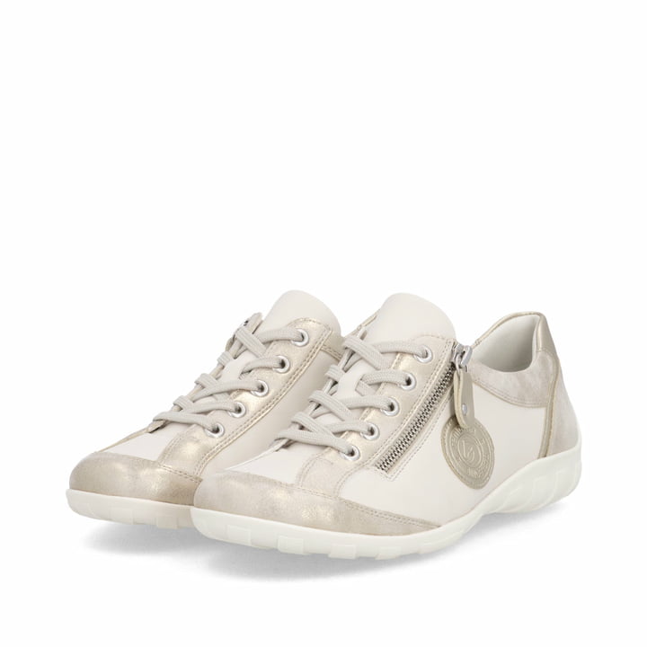 Beige vegane remonte Damen Schnürschuhe R3408-61 mit einem Reißverschluss. Schuhpaar seitlich schräg.