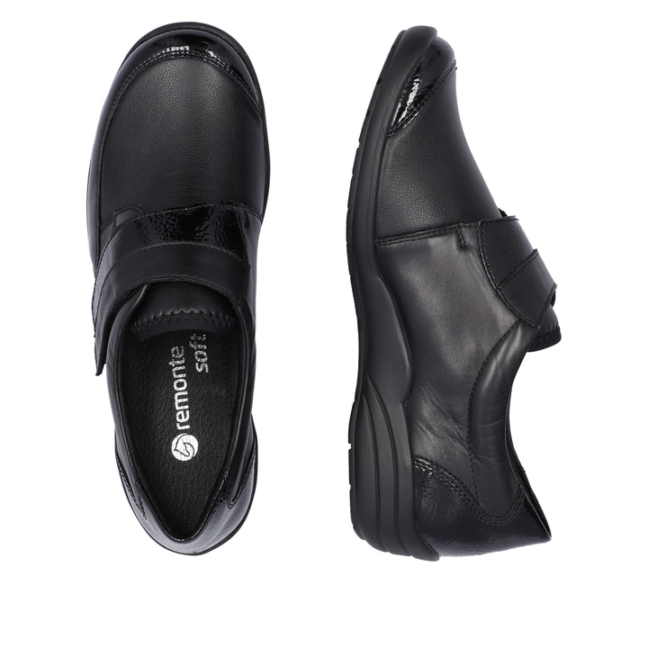 Schwarze remonte Damen Slipper R7600-04 mit Klettverschluss sowie Extraweite H. Schuh von oben, liegend.