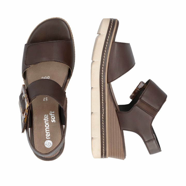 Dunkelbraune remonte Keilsandaletten D2L53-25 mit trendiger Schnalle. Schuh von oben, liegend.