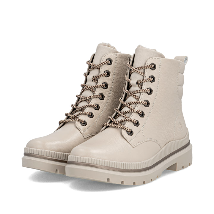 Beige remonte Damen Schnürstiefel D0C82-60 mit griffiger Glass-Fibre Sohle. Schuhpaar seitlich schräg.
