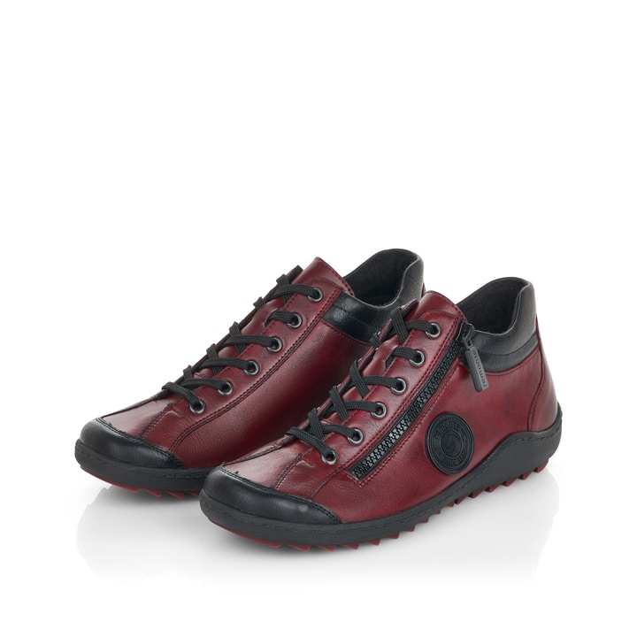 Weinrot-schwarze remonte Damen Schnürstiefel R1477-35 mit einem Reißverschluss. Schuhpaar seitlich schräg.
