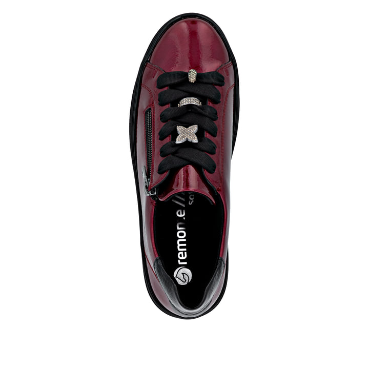 Baskets basses remonte rouges pour femme D1C09-35 avec fermeture éclair. Semelle extérieure de la chaussure.