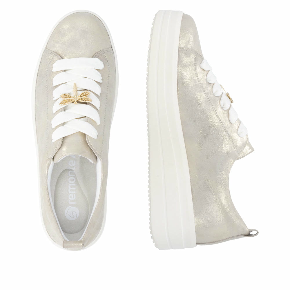 Goldene remonte Damen Sneaker Low D1C03-91 mit dekorativem Schmuckdetail. Schuh von oben, liegend.